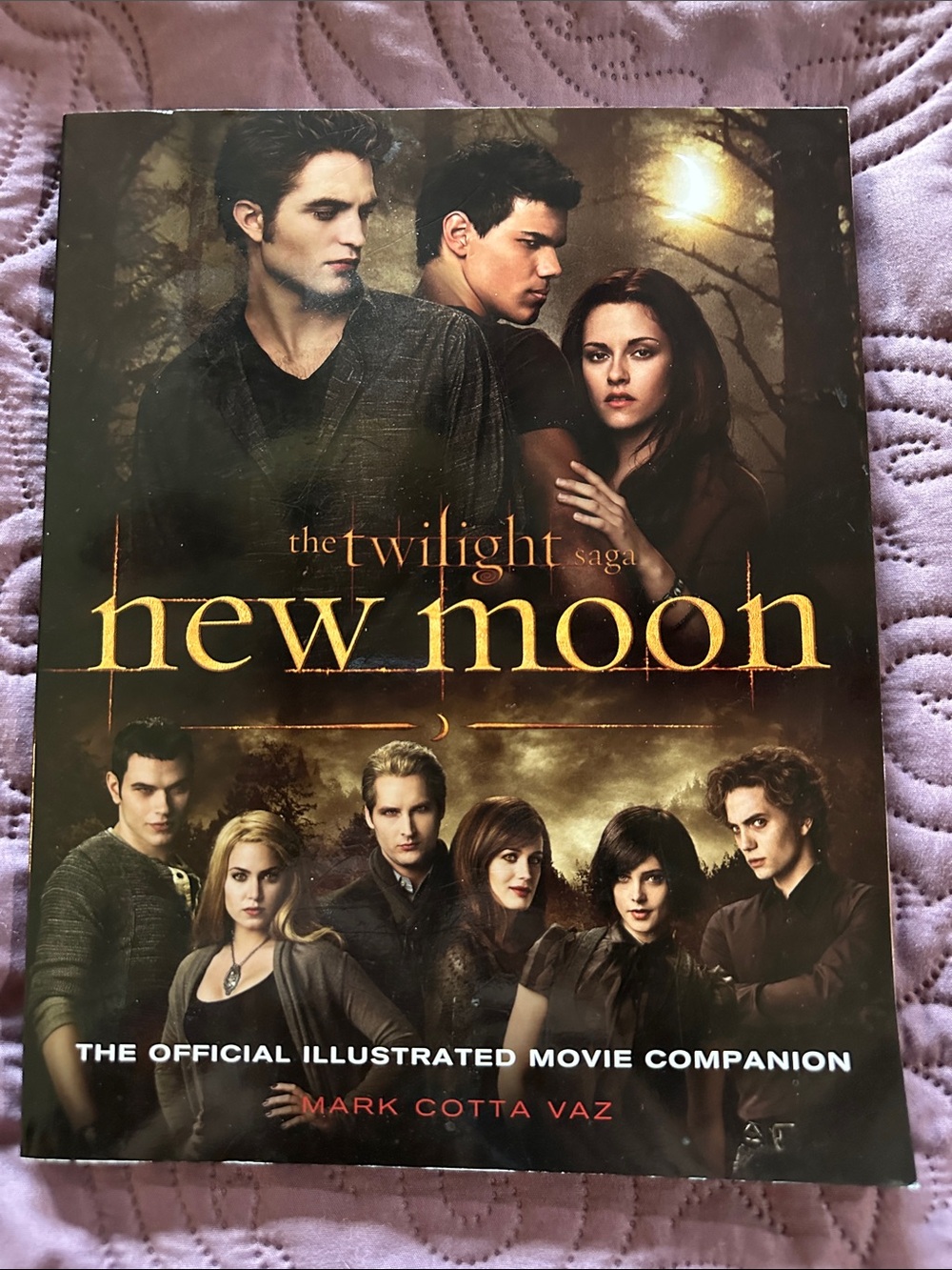 Official new moon twilight movie book- beautiful pictures. 141 pages. Soft cover